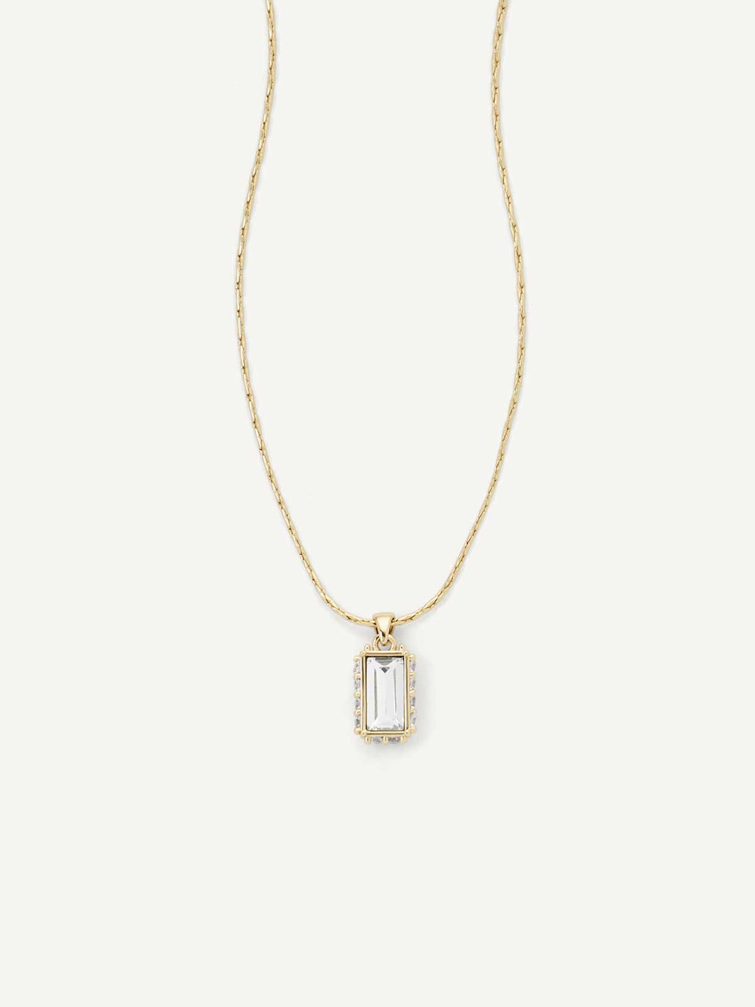 Gold necklace with a rectangular pendant on a white background