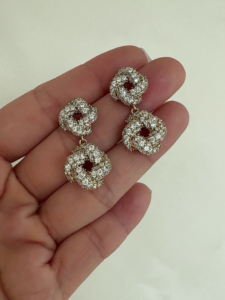 Pair of gold drop earrings with crystal-like stones